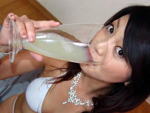 Asian is drinking a large